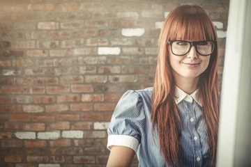 Composite image of attractive smiling hipster woman posing 