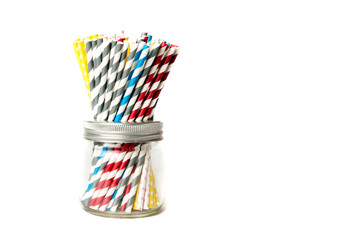 Several drinking straws in a jar