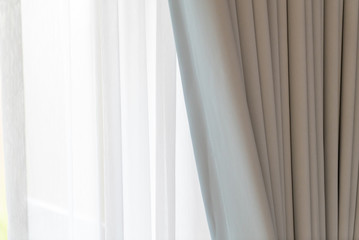 Obraz premium White door curtain with sunlight in the morning