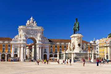 Beautiful image of the gate and statue of  King Jose on the Commerce square (Praca do Comercio) in...