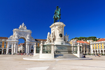 Beautiful image of the gate and statue of  King Jose on the Commerce square (Praca do Comercio) in...