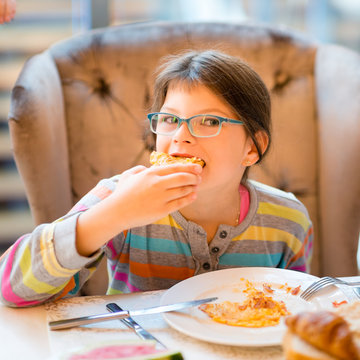 Pretty Girl Eating Breakfast