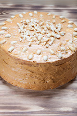 Homemade peanut cake on wooden background. Selective focus