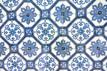 Close up image of the beautifully decorated tiles on the houses in the streets of Lisbon, Portugal