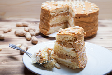 Homemade peanut cake on wooden background. Selective focus