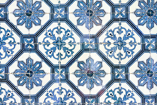 Close up image of the beautifully decorated tiles on the houses in the streets of Lisbon, Portugal