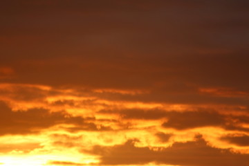 Reddish and cloudy sky at sunset in Bregenz, Austria.