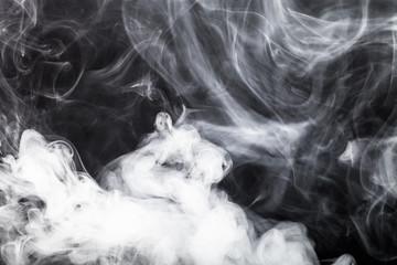 Smoke on a black background. Toned