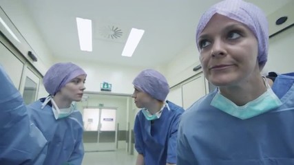 Hospital Emergency Team Carrying Stretcher with Patient through Hospital Hall. Shot on RED Cinema Camera.