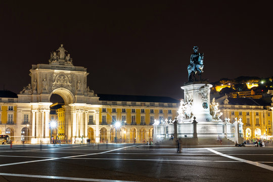 View on the gate on the Commerce square (Praca do Comercio) and the statue of King Jose at night in Lisbon, Portugal