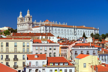 Fototapeta na wymiar Beautiful colorful and vibrant summer cityscape of Lisbon, Portugal, looking towards the Monastery Vicente de fora