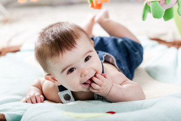 Beautiful newborn baby girl having fun.