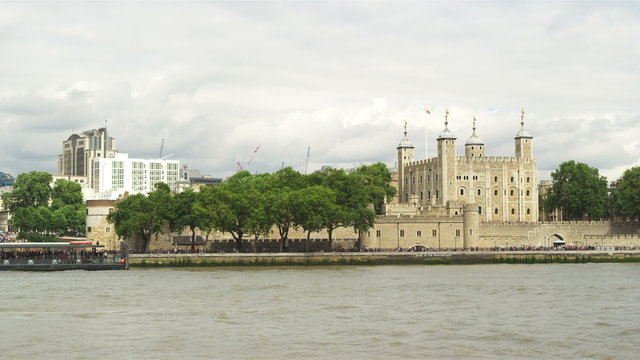 Slow motion view across the River Thames towards the Tower of London, London, England