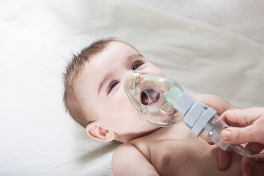 Doctor Makes Inhalation To A Sick Little Baby.