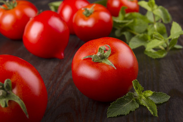 red tomato on a dark board