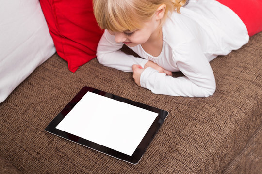 Little Girl Looking At Blank Screen Tablet 