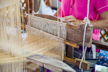 Silk weaving on loom.