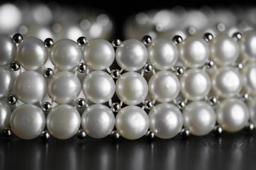 Pearl necklace on a dark background