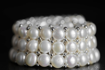 Pearl necklace on a dark background