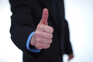 Businessman giving thumbs up sign