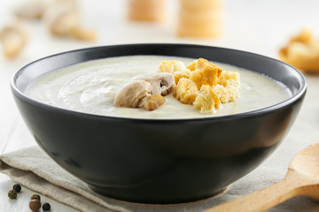 Fresh mushroom cream soup, French traditional food, close-up