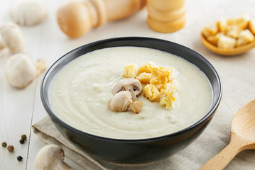 Tasty mushroom cream soup for lunch, ingredients on a table, European food
