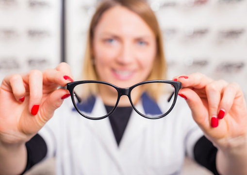 Optometrist offering optic glasses  