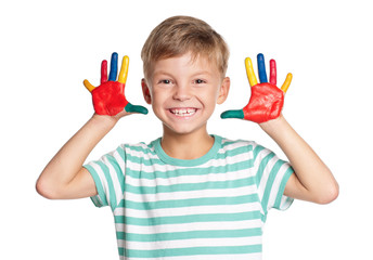 Naklejka premium Happy little boy with paints on hands