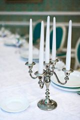 Candlestick wedding decoration on the table.