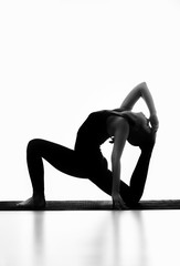 the girl is engaged in yoga,BW