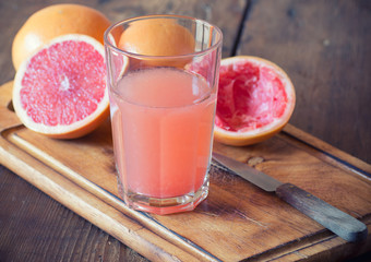 Glass of fresh organic grapefruit juice ready to drink © lecic