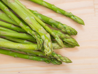 Fresh asparagus on wooden table, closeup