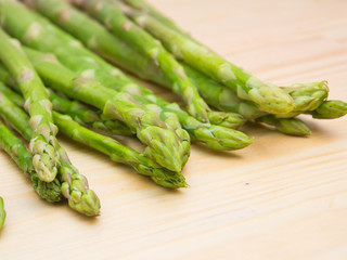 Fresh asparagus on wooden table, closeup
