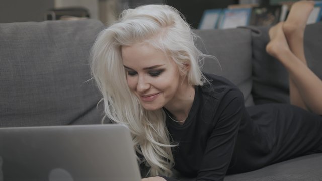 Beautiful Blonde Girl Chat with Laptop and Smile