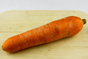 not a perfect organic carrots on wooden background