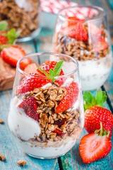 Homemade granola parfait with strawberry and mint.