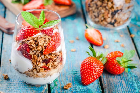 Homemade granola parfait with strawberry and mint.