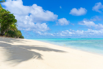 White beach on desert island in Rarotonga, Cook Islands