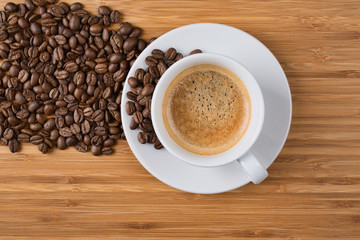 Coffee cup top view on wooden table background
