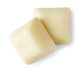 White chocolate pieces on white background