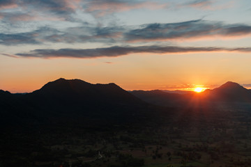 Sunset landscape orange sky and silhouette mountain