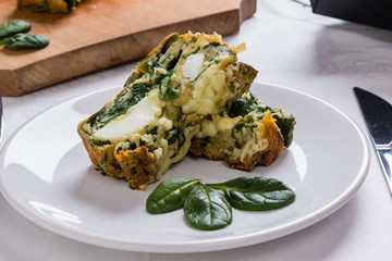 spinach souffle on white plate