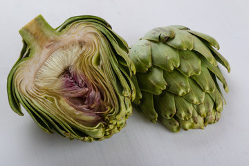 Obraz premium sliced artichoke on white table