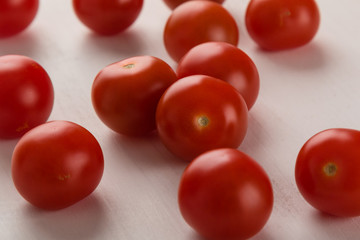 cherry tomatoes on white table