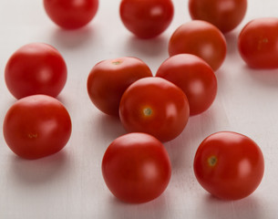 cherry tomatoes on white table