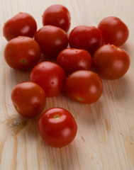 cherry tomatoes on wooden table