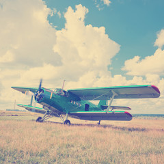 old airplane on green grass