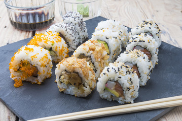 Sushi rolls on a slate plate