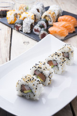 Salmon and caviar rolls served on a plate