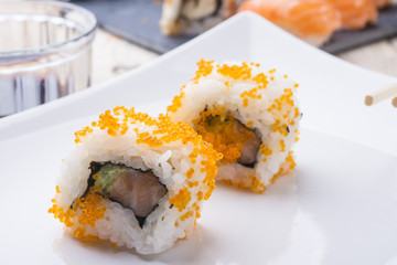 Salmon and caviar rolls served on a plate © DalaiFood